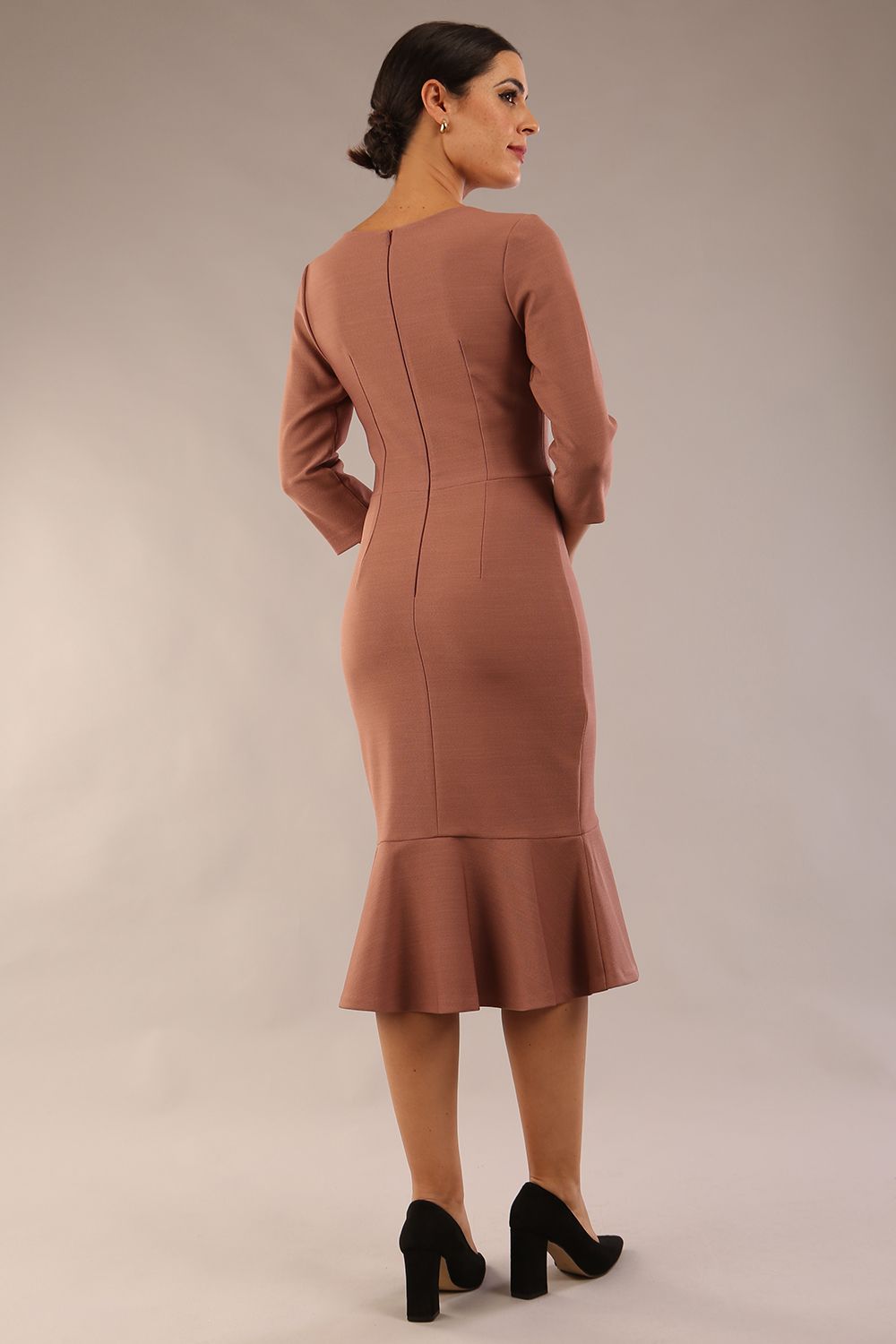 model wearing a diva catwalk Seed Brecon Fishtail Sleeved Dress in acorn brown colour back