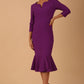 model wearing a diva catwalk Seed Brecon Fishtail Sleeved Dress in amethyst purple colour