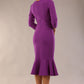 model wearing a diva catwalk Seed Brecon Fishtail Sleeved Dress in amethyst purple colour back