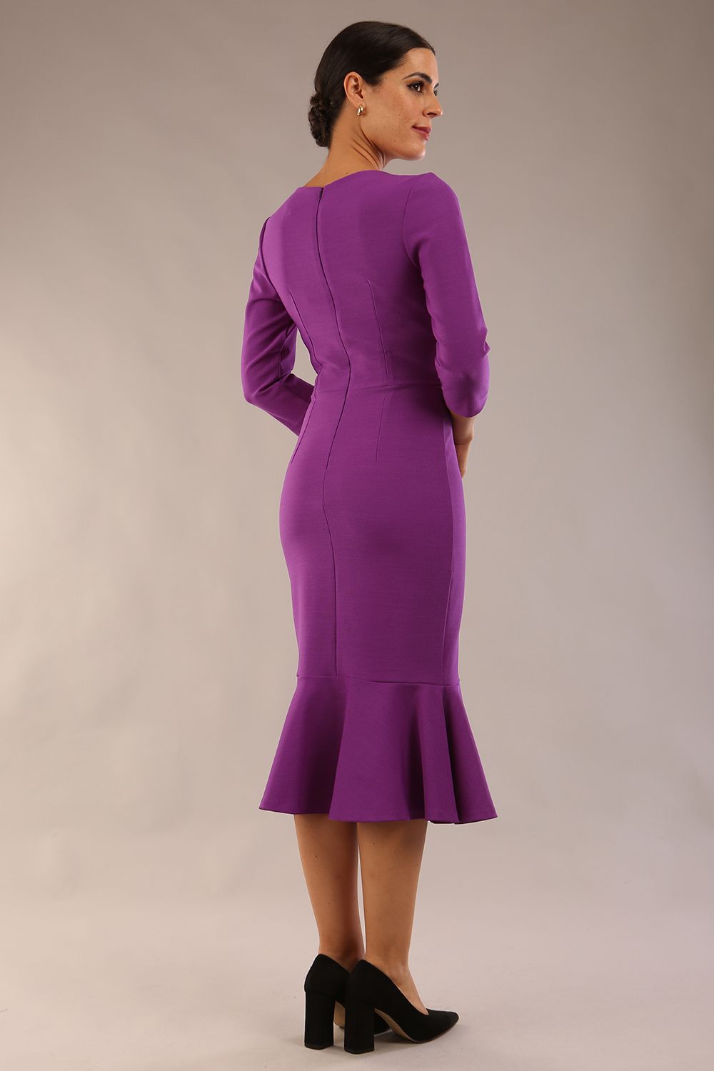 model wearing a diva catwalk Seed Brecon Fishtail Sleeved Dress in amethyst purple colour back