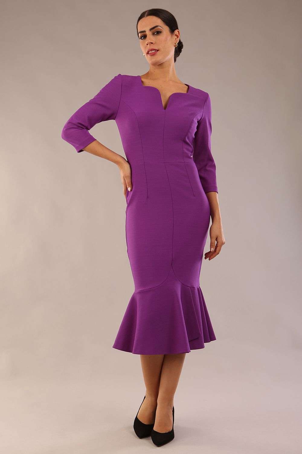 model wearing a diva catwalk Seed Brecon Fishtail Sleeved Dress in amethyst purple colour front