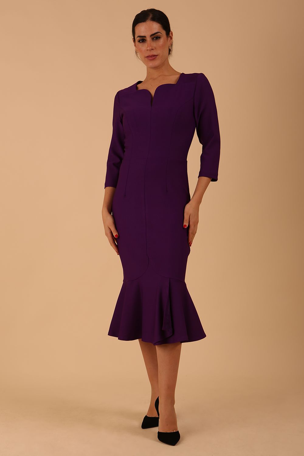 model wearing a diva catwalk Seed Brecon Fishtail Sleeved Dress in imperial purple colour