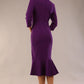 model is wearing a diva catwalk Seed Brecon Fishtail Sleeved Dress in imperial purple colour back