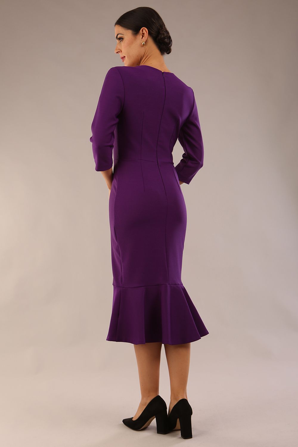 model is wearing a diva catwalk Seed Brecon Fishtail Sleeved Dress in imperial purple colour back