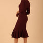 model wearing a diva catwalk Seed Brecon Fishtail Sleeved Dress in port royale colour
