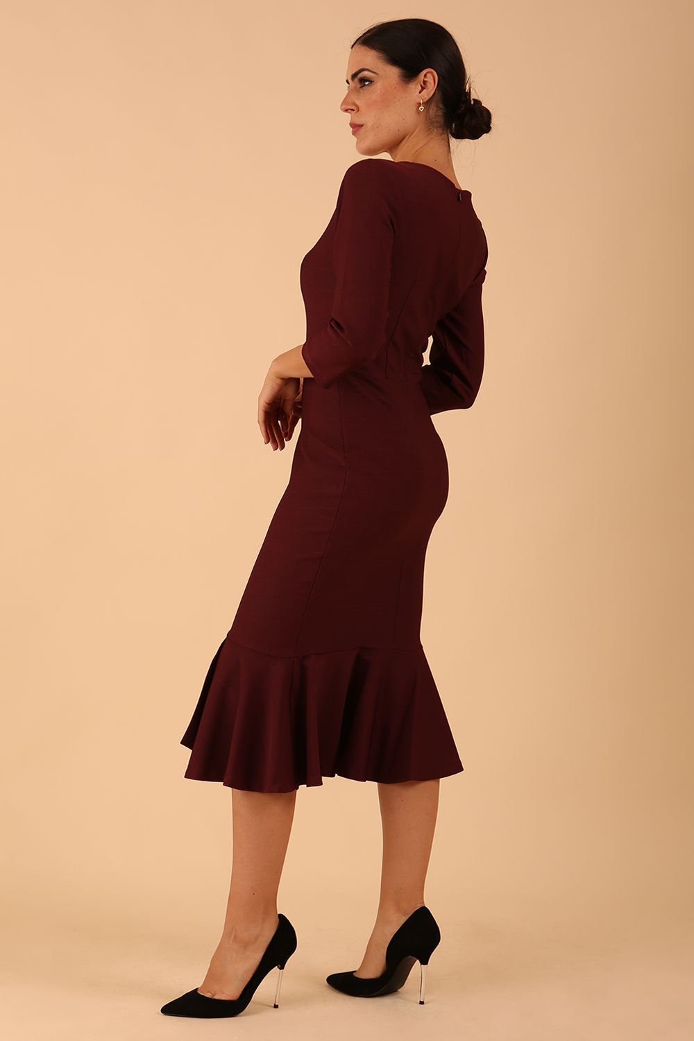 model wearing a diva catwalk Seed Brecon Fishtail Sleeved Dress in port royale colour