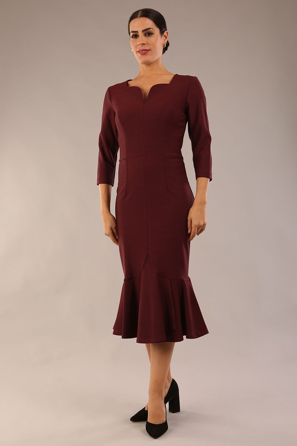 model is wearing a diva catwalk Seed Brecon Fishtail Sleeved Dress in port royale colour front