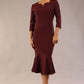 model is wearing a diva catwalk Seed Brecon Fishtail Sleeved Dress in port royale colour front