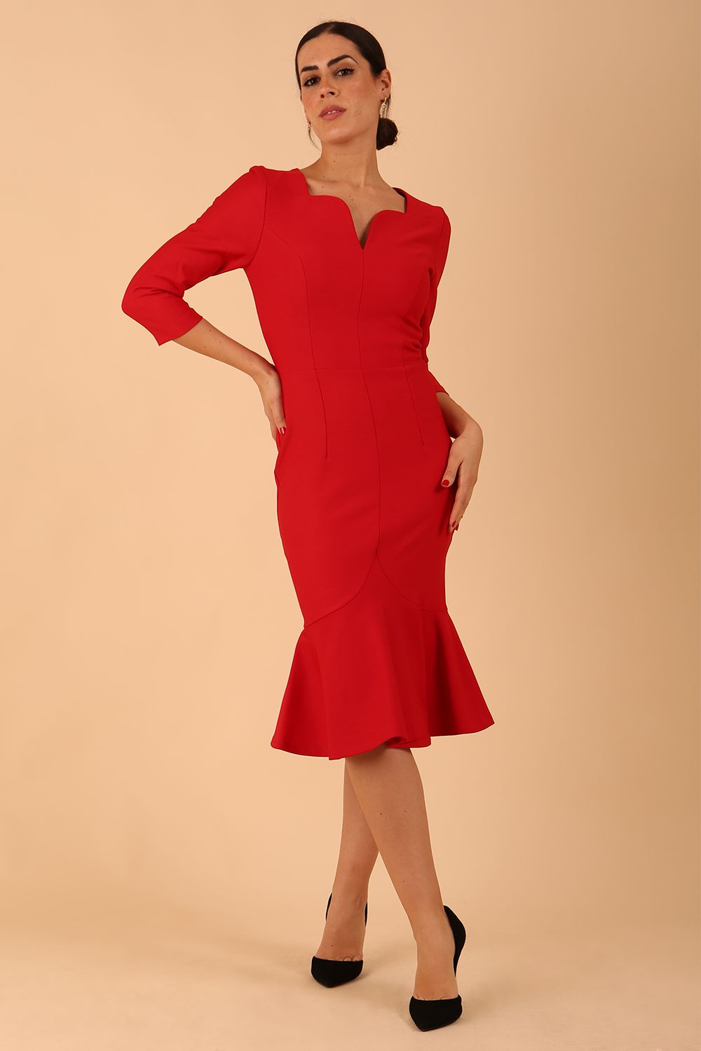 model wearing a diva catwalk Seed Brecon Fishtail Sleeved Dress in salsa red colour