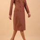 Brunette model wearing a diva catwalk Seed Silverstone Long Sleeve Coat Dress with 6 buttons across the front and pockets in colour Acorn Brown front side