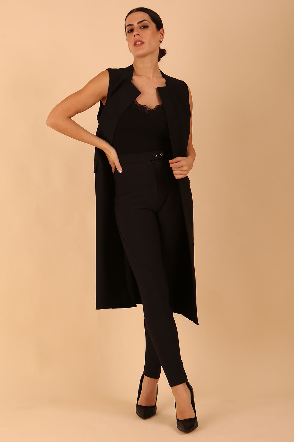 model wearing a divacatwalk Seed Harvard Sleeveless Coat midi length in black colour front