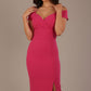 Woman wearing a honeysuckle pink diva catwalk hayward pencil dress with short sleeves against a beige background
