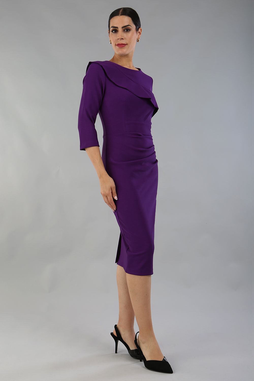 model wearing a diva catwalk Seed Aspley Sleeved Pencil Skirt Casual Dress with 3/4 sleeve and knee length in imperial purple colour