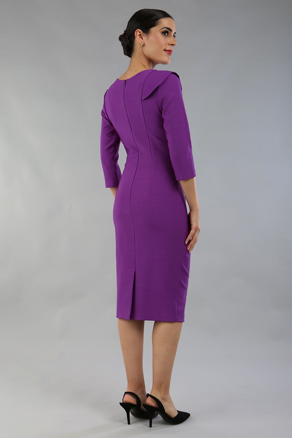 model wearing a diva catwalk Seed Aspley Sleeved Pencil Skirt Casual Dress with 3/4 sleeve and knee length in amethyst purple colour