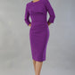 model wearing a diva catwalk Seed Aspley Sleeved Pencil Skirt Casual Dress with 3/4 sleeve and knee length in amethyst purple colour