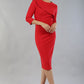 model wearing a diva catwalk Seed Aspley Sleeved Pencil Skirt Casual Dress with 3/4 sleeve and knee length in salsa red colour