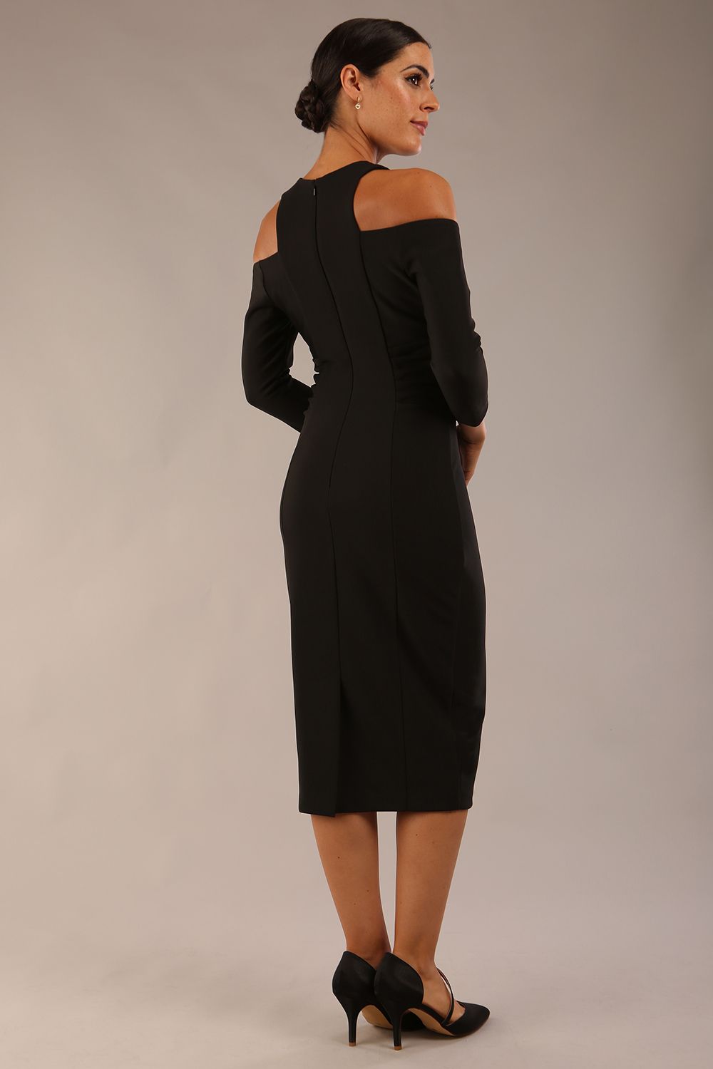 model is wearing diva catwalk kelso sleeved pencil dress with shoulder cut out and rounded high neck in black back