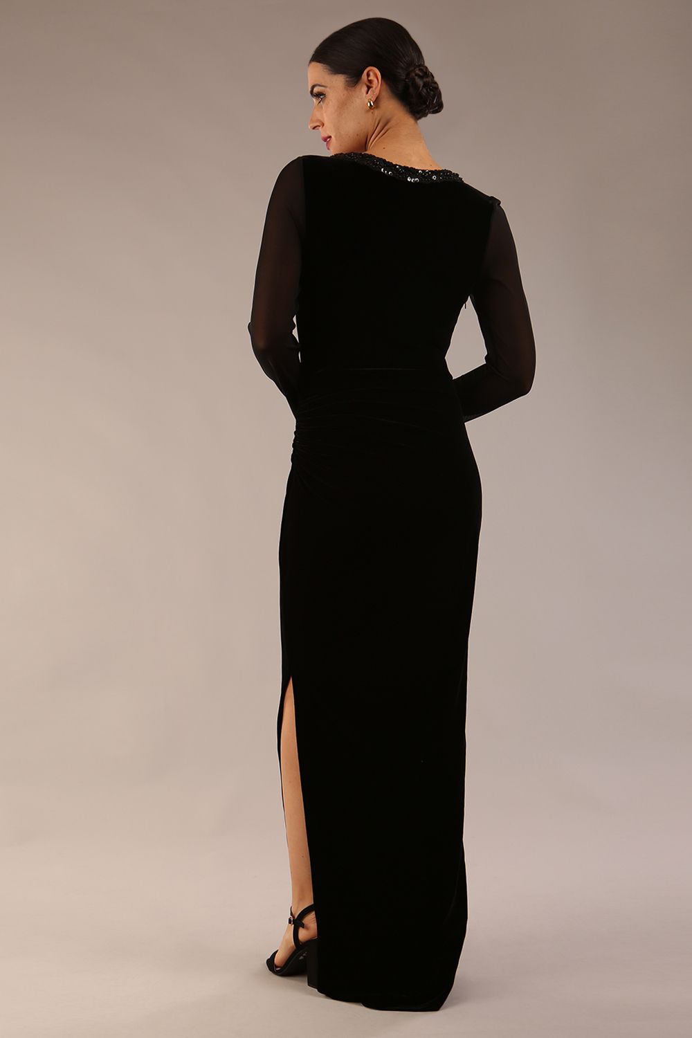 Model wearing diva catwalk Isabella Velvelt Long Sleeve Maxi Length Dress in Black side