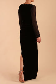 Model wearing diva catwalk Isabella Velvelt Long Sleeve Maxi Length Dress in Black back