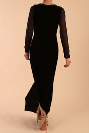 Model wearing diva catwalk Isabella Velvelt Long Sleeve Maxi Length Dress in Black back