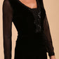 Model wearing diva catwalk Isabella Velvelt Long Sleeve Maxi Length Dress in Black neckline detail