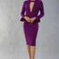 model is wearing diva catwalk fifi pencil skirt dress with three quarter flute sleeve and rounded neckline with a cut out at the front in magic purple 