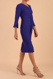 Model wearing diva catwalk Seed Orla Asymmetric Pencil Dress in Palace Blue front side