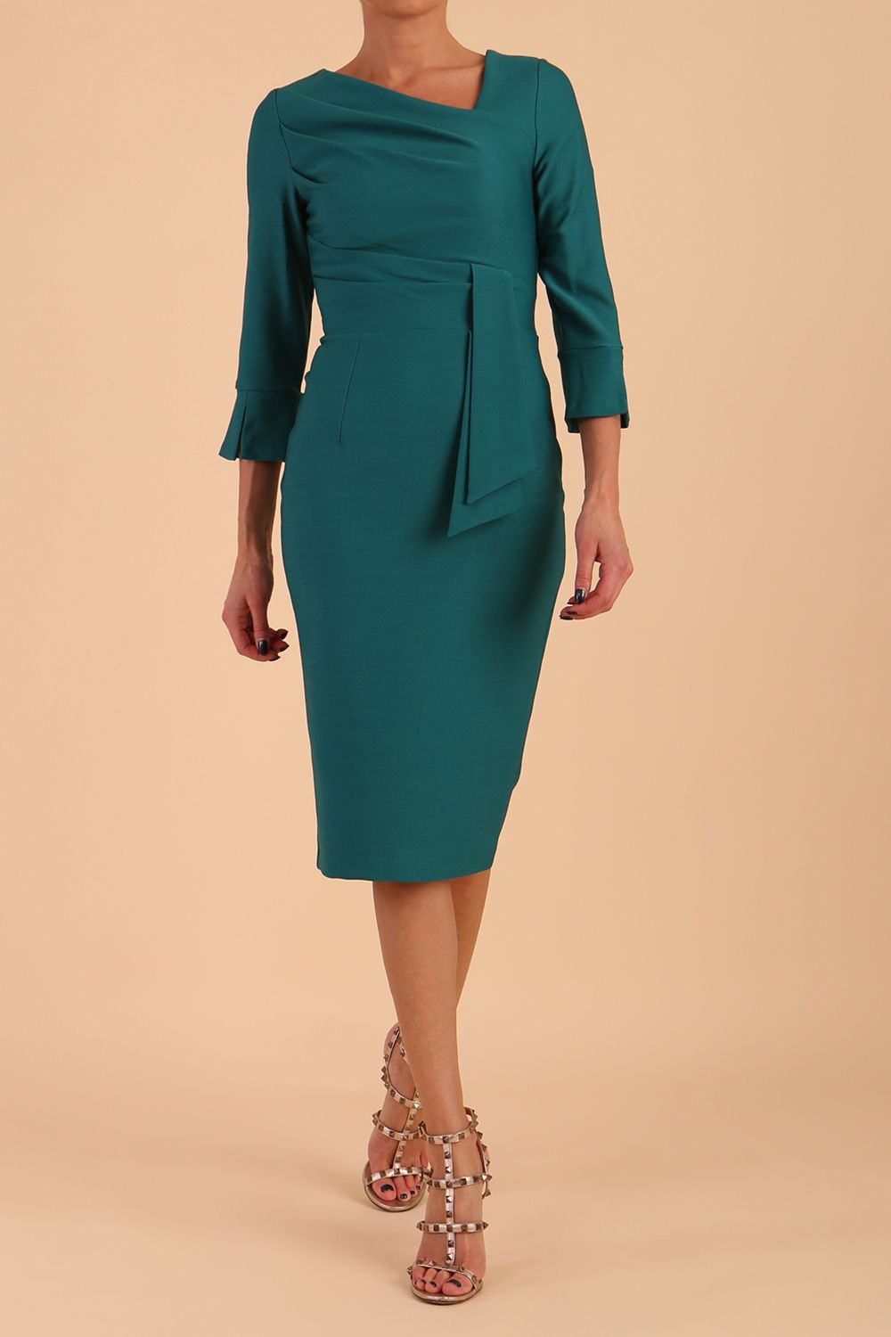 Model wearing diva catwalk Seed Orla Asymmetric Pencil Dress in Pacific Green front 