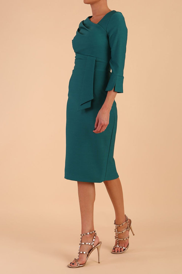 Model wearing diva catwalk Seed Orla Asymmetric Pencil Dress in Pacific Green front side