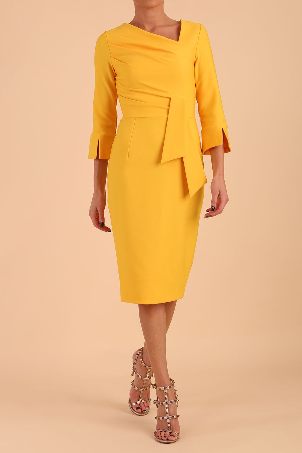 Model wearing diva catwalk Seed Orla Asymmetric Pencil Dress in Saffron Yellow front