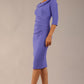 model is wearing diva catwalk seed axford pencil sleeved dress with rounded folded collar in dawn indigo front