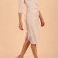 model is wearing diva catwalk seed axford pencil sleeved dress with rounded folded collar in Sandy Cream front side