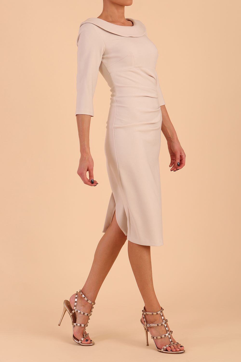 model is wearing diva catwalk seed axford pencil sleeved dress with rounded folded collar in Sandy Cream front side