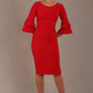 A woman wearing a electric red knee-length diva catwalk meridian pencil dress with a round neckline, double layered peplum three quarter length sleeves, and standing against a plain background.