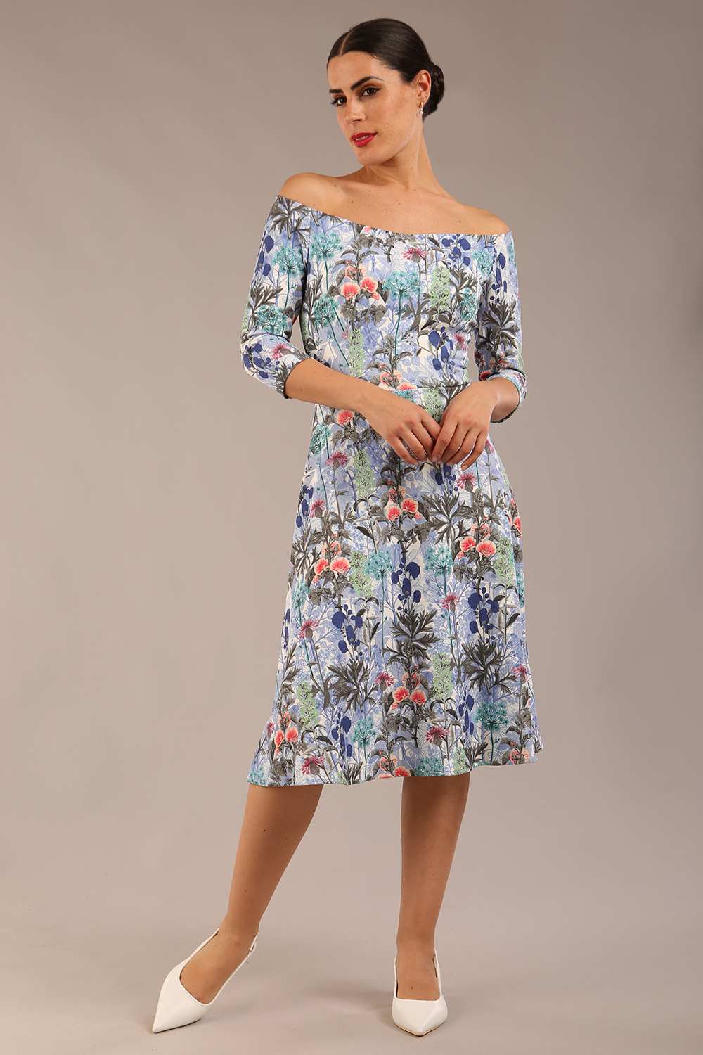 brunette model is wearing a diva catwalk islay a-line wing print dress off shoulder and knee length in water garden print front image