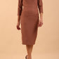 brunette model wearing diva catwalk couture althorp pencil fitted dress with sleeves and rounded neckline and bow detail at the top in acorn brown colour front