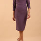 brunette model wearing diva catwalk couture althorp pencil fitted dress with sleeves and rounded neckline and bow detail at the top in dusky lilac colour front