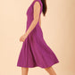 model wearing diva catwalk rochelle swing skirt a line dress without sleeves with a low v neck in royal purple side