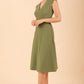 model wearing diva catwalk rochelle swing skirt a line dress without sleeves with a low v neck in vineyard green front