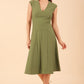 model wearing diva catwalk rochelle swing skirt a line dress without sleeves with a low v neck in vineyard green front