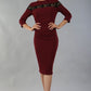 Model wearing the Diva Atlantis Pencil dress with three quarter length sleeves in cabaret burgundy and black front image