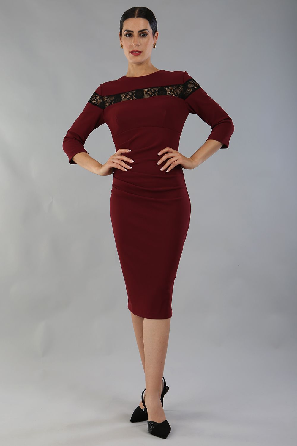 Model wearing the Diva Atlantis Pencil dress with three quarter length sleeves in cabaret burgundy and black front image