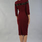 Model wearing the Diva Atlantis Pencil dress with three quarter length sleeves in cabaret burgundy and black back image