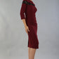 Model wearing the Diva Atlantis Pencil dress with three quarter length sleeves in cabaret burgundy and black side image