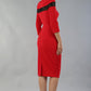 Model wearing the Diva Atlantis Pencil dress with three quarter length sleeves in true red and black back image