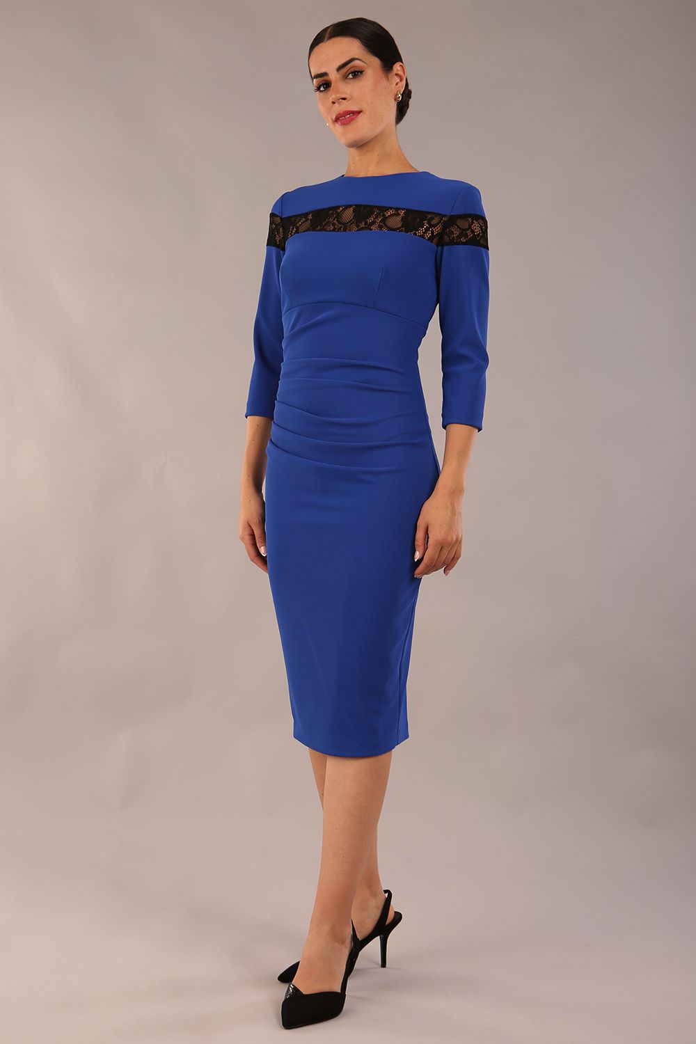 Model wearing the Diva Atlantis Pencil dress with three quarter length sleeves in cobalt blue and black front image