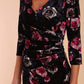 Model wearing Diva Catwalk Vella Asymmetric Dress 3/4 sleeve asymmetric hemline with v neckline in Rose Blossom Print front detail