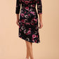 Model wearing Diva Catwalk Vella Asymmetric Dress 3/4 sleeve asymmetric hemline with v neckline in Rose Blossom Print back