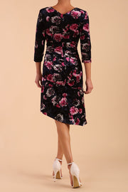 Model wearing Diva Catwalk Vella Asymmetric Dress 3/4 sleeve asymmetric hemline with v neckline in Rose Blossom Print back