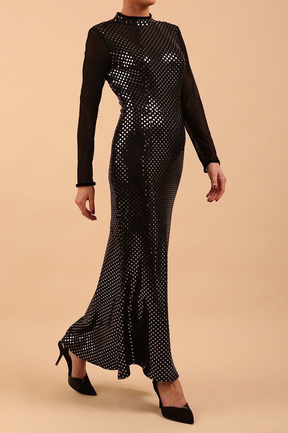 Brunette Model wearing a long full length metallic sparkle dress by Diva Catwalk front side